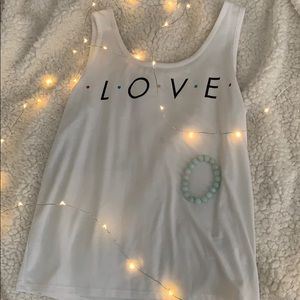 The tv show friends themed white tank top😮💕